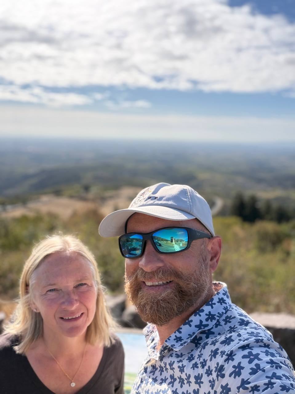 Emma and Phil Balderson together at a mountain viewpoint